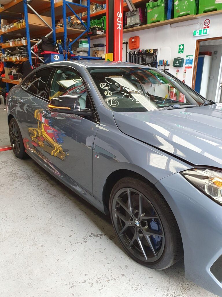 How BMW Breakers Like MT Auto Parts Help Reduce Automotive Waste Grey BMW 2 Series Gran Coupe in the MT Auto Parts workshop